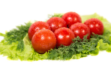 tomatoes lying on lettuce leaf