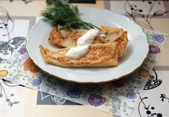 Pancakes with sour cream and dill