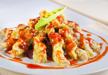 Appetizing Main Course on Table Utensils on Side