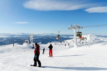 Skiers on the top of the piste