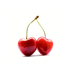 Two heart-shaped cherries isolated in white