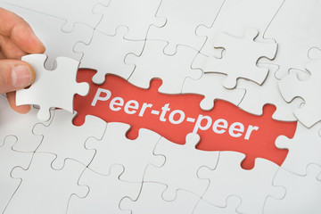 Fototapeta premium Peer-to-peer Text Under White Jig Saw Puzzle