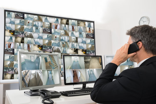 Security System Operator Looking At Cctv Footage