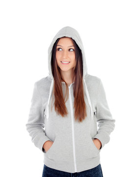 Happy hooded girl with grey sweatshirt looking at side