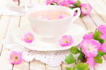 Beautiful fruit blossom with cup of tea