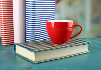 Color cup of tea with books