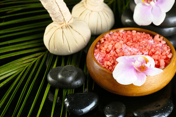 Beautiful spa composition with flowers on dark background