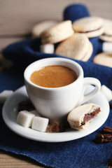 Gentle colorful macaroons and  coffee in mug