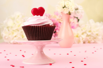 Delicious cupcake for Valentine Day on pink background