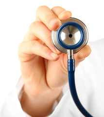 Male doctor working with stethoscope