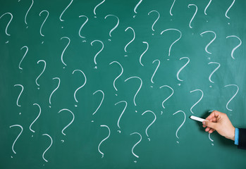 Businessman Drawing Question Mark Sign