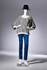 full-length female striped clothing in hat on mannequin