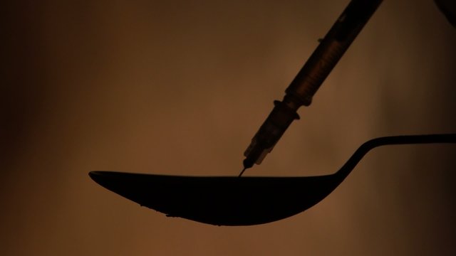 Silhouette of a spoon in which the drug is prepared