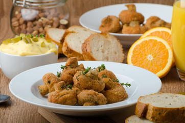 Breaded fried mushrooms with juice
