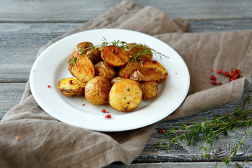 Baked potatoes with greens on a plate
