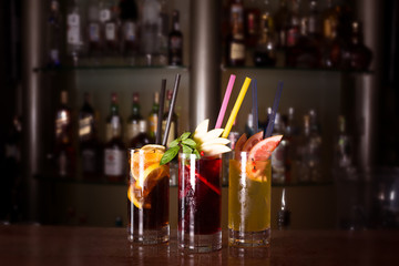 Cherry bomb, screwdriver and cuba libre cocktails in a tall glas