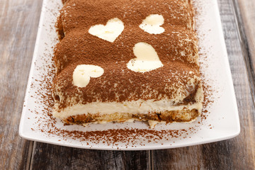 Tiramisu cake decorated with hearts