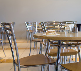 Plate with a pastry on a table in a cafe