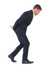 Businessman putting hands behind