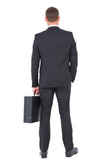 Businessman standing with his briefcase