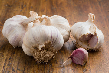 garlic with clove on a wood table