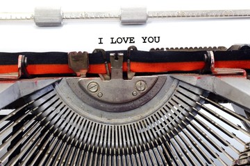 Fototapeta na wymiar written typewriter I LOVE YOU with black ink
