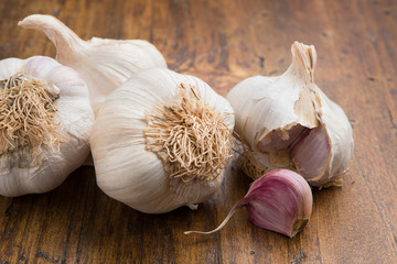 garlic with clove on a wood table