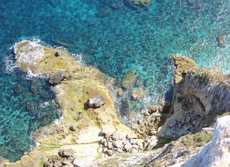 high cliff on the sea with waves