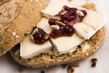 bread served with camembert and cranberry