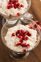Dish of banana millet breakfast pudding with pomegranate