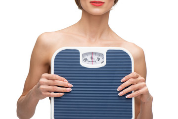 Close up portrait of woman holding weighs