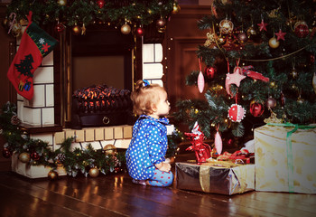 little girl with presents at christmas