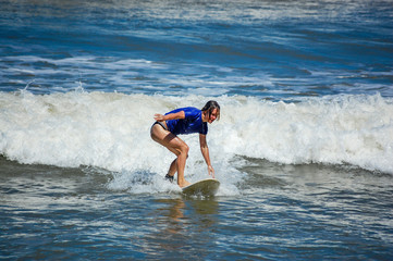 young woman surfing