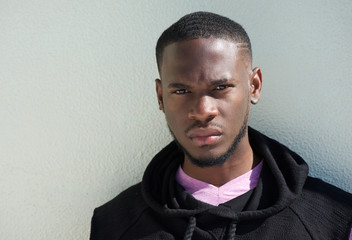 Obraz premium Close up portrait of a serious african american young man
