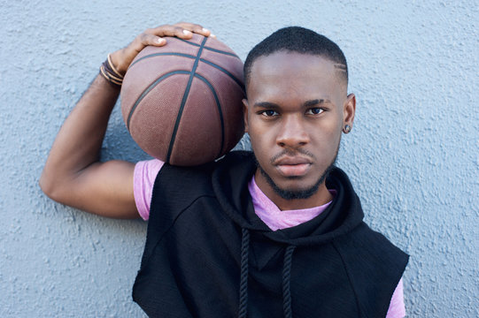 Young African American Man Holding Basketball