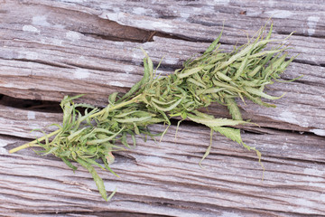 Cannabis on grunge wooden desk