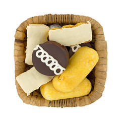 Junk food cakes and donuts in a basket