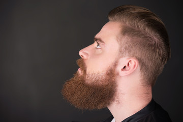 Fototapeta premium Stylish man with beard looking up