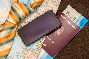Passport map, smart phone and suit