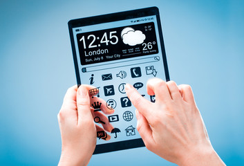 Tablet with transparent screen in human hands.