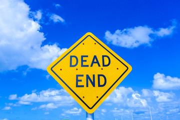 dead end street sign under blue sky