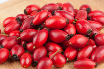 Pile of red Rose Hips - Stock Image