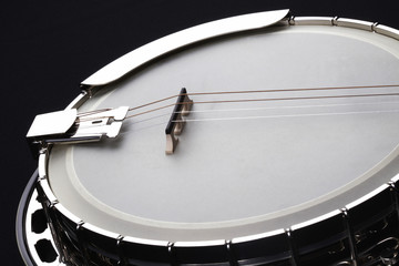 Metalic banjo isolated on black background
