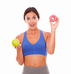 Hungry pretty young woman holding food