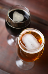 Two glasses of beer in a case