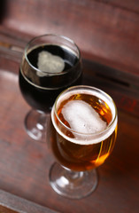 Two glasses of beer in a case