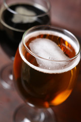 Two glasses of beer in a case