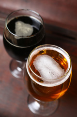 Two glasses of beer in a case