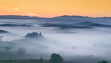 Sunrise and mist in Tuscany Field