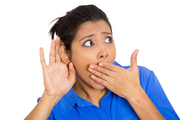 young nosy woman hand to ear gesture secretly listening 